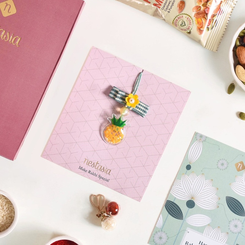 Puffy Pineapple Girl Rakhi Hamper Set Of 3 With Box And Card